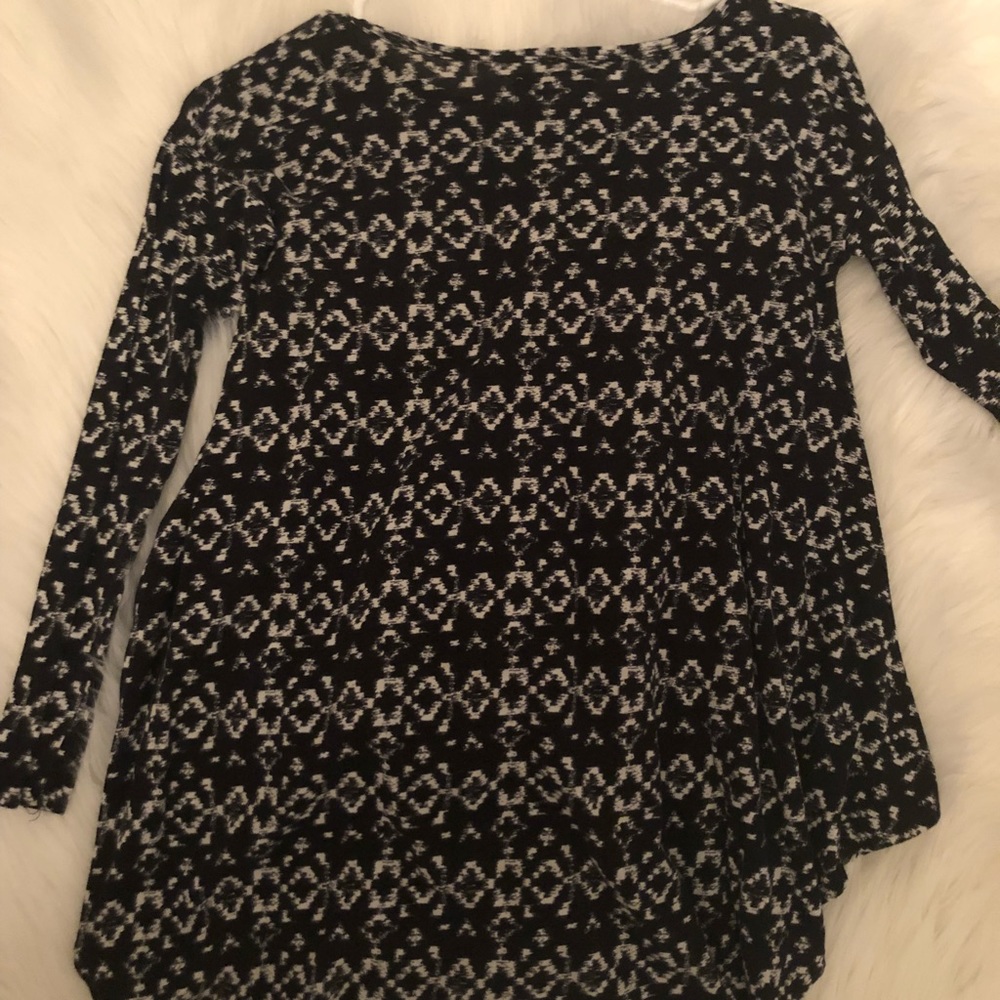 I am selling a long sleeve patterned top.